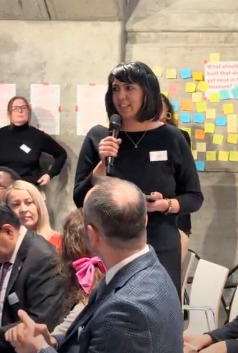 woman speaking into a microphone